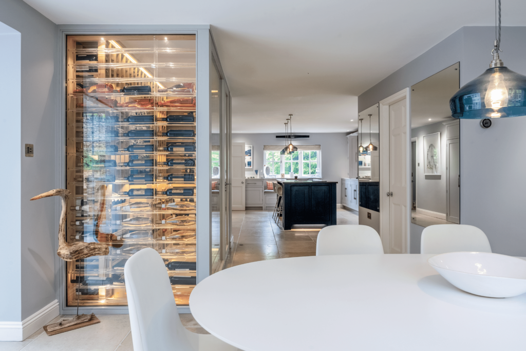 A residential wine wall within a kitchen featuring wine racking