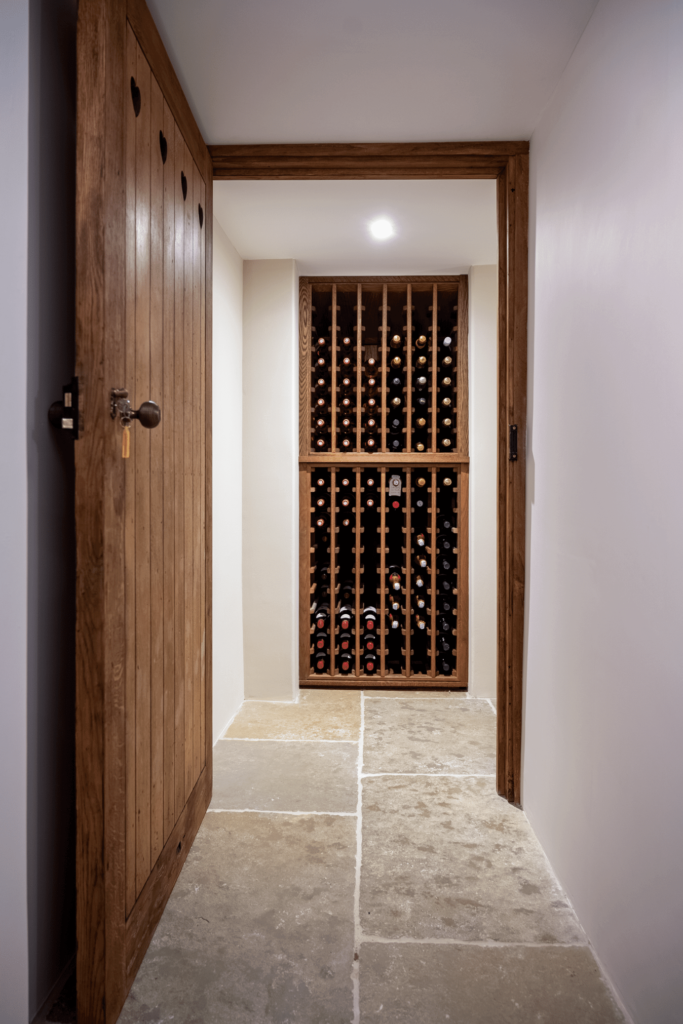 small wine wall design within the basement wine cellar