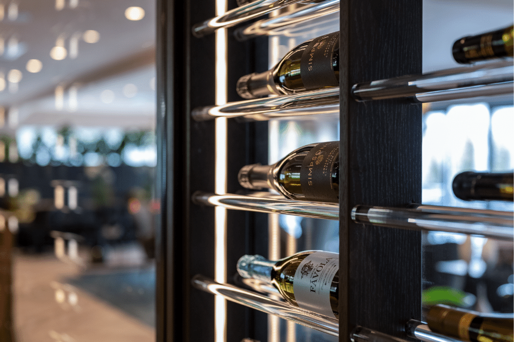 acrylic wine racks within a window