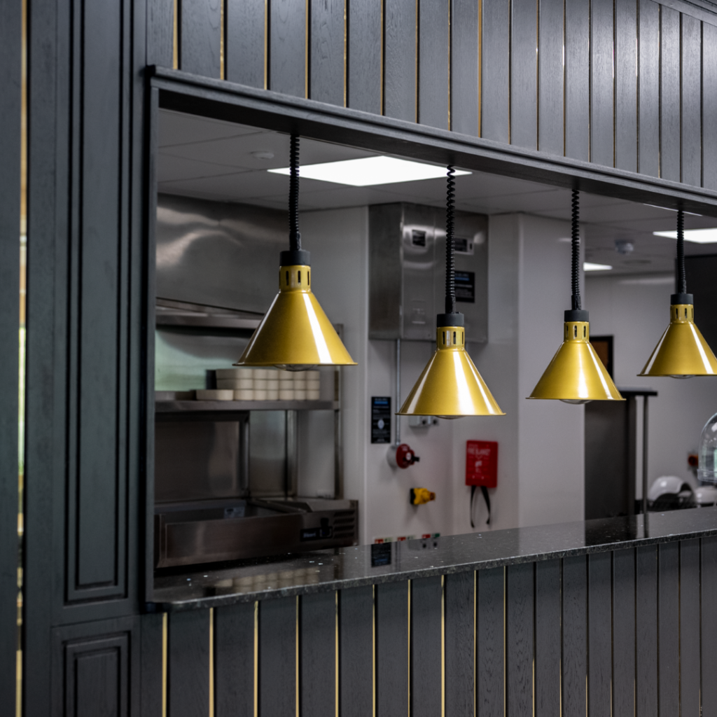 The kitchen pass at Sopers House in Cuffley. A matte black finish with bronze inlays