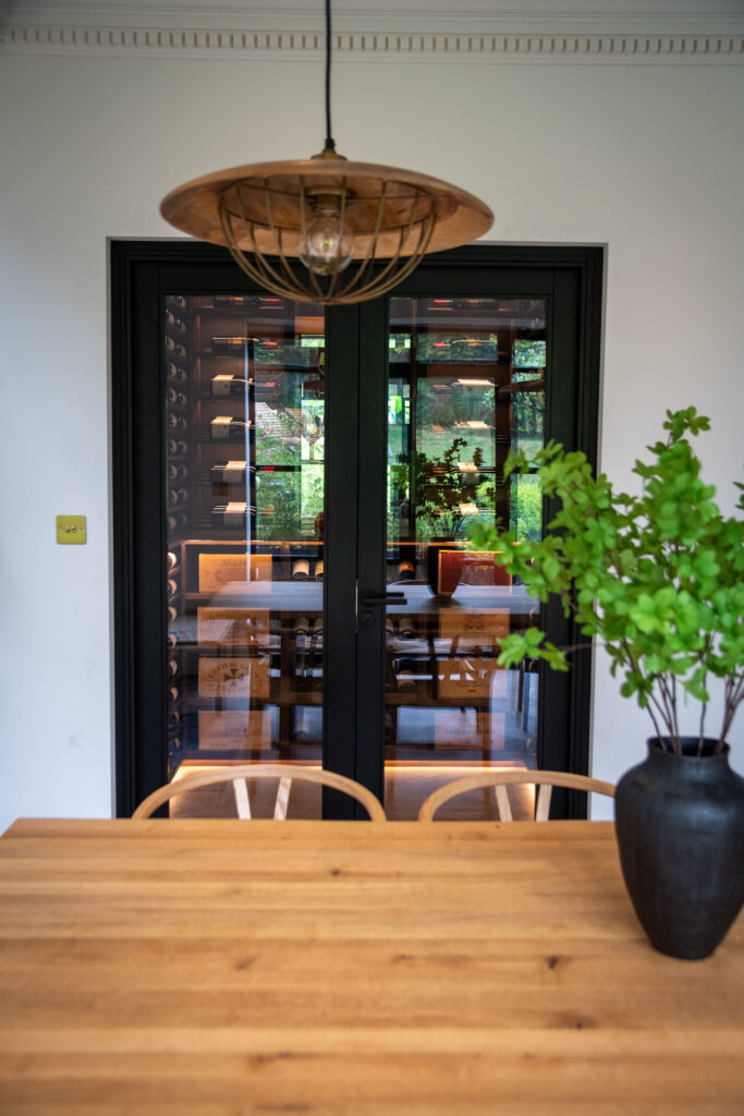Double doors leading through to a luxury wine cellar