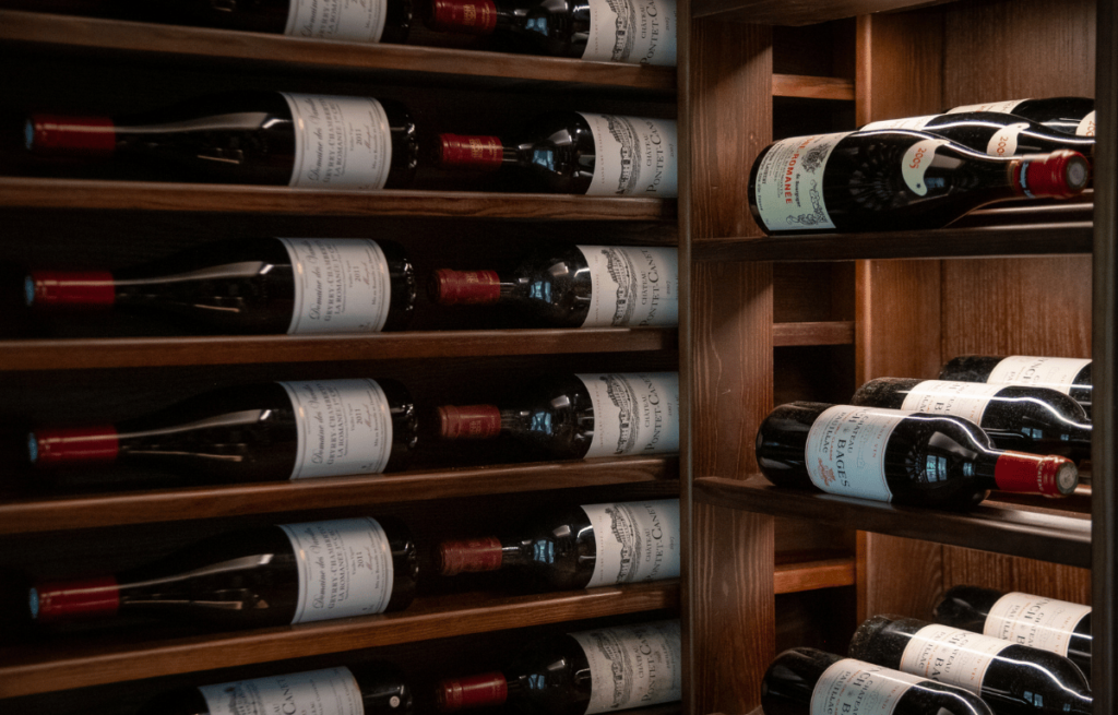 Scallop wine racking with label facing bottles, staggered three deep storage for optimal capacity.