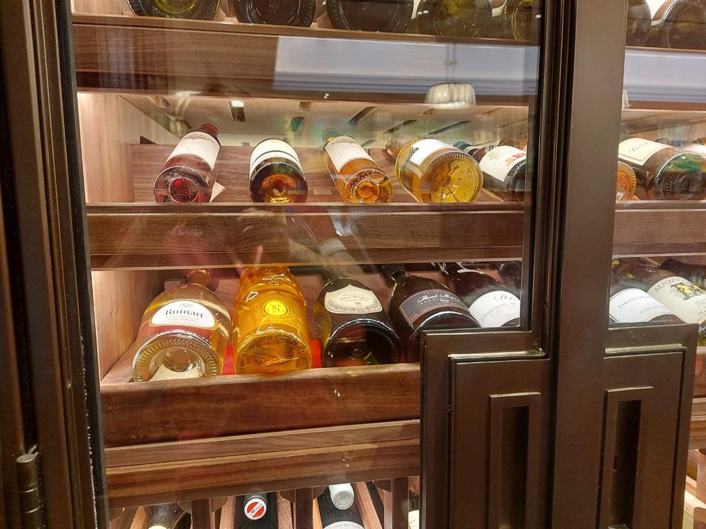 A detailed shot of the luxury wine racks at the Beaumont Hotel