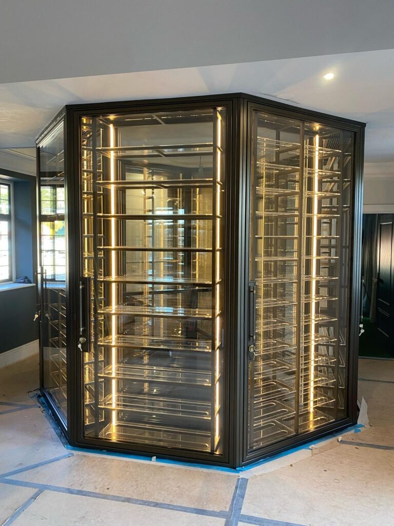 a hexagonal wine room with a central spiral staircase