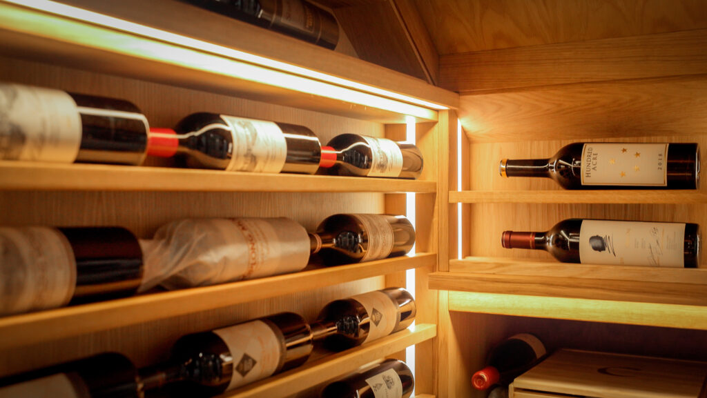 A close up of Sorrells wine racking with bottles laid upon it